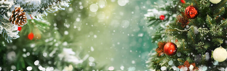 Wall Mural - winter panoramic background with snow-covered spruce branches, christmas tree decorated with toys in