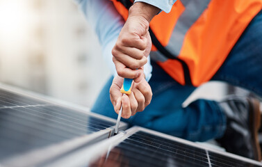 Wall Mural - Solar panels, tool and closeup of male engineer doing maintenance or repairs with screwdriver. Renovation, handyman and zoom of an industrial worker working on eco friendly construction on rooftop.