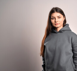 Poster - Brunette woman wearing a sweatshirt with a hood. Beautiful girl blank one color jumper.