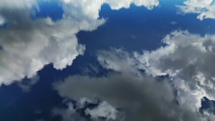 Wall Mural - aerial top view of blue sky with clouds reflection in water of lake, abstract background, timelapse 