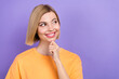 © deagreez - Photo of positive cheerful woman with bob hairstyle wear yellow t-shirt look at dental ad empty space isolated on purple color background