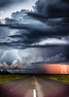 Unwetter auf einer Landstraße mit Gewitter und Regenwolken - ai, genartiv