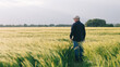 © Hryhor Denys - Checking the yield of grain crops at sunset. Man conducts experiments in field conditions.