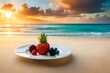 A tropical fruit platter served on the sandy shore with the ocean in the background.