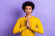 © deagreez - Photo of young funny man wear yellow shirt arms together palms help praying for ukraine god bless him isolated on purple color background
