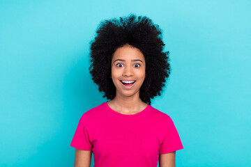 Poster - Photo of excited funky little girl dressed pink t-shirt smiling open mouth isolated teal color background