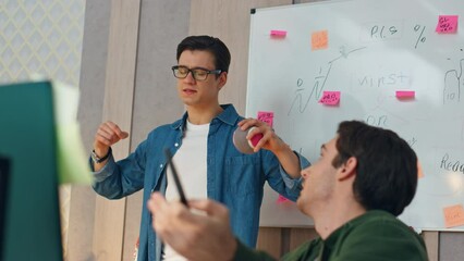 Wall Mural - Nervous guys discussing computer project closeup. Two startupers brainstorming