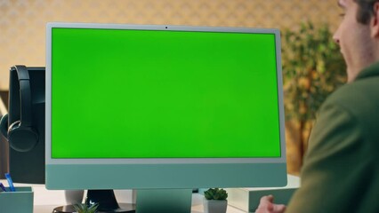Wall Mural - Designer video chatting mockup monitor in workplace. Man having internet call