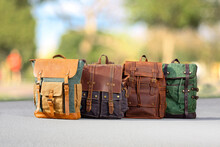 Four Backpacks In Outdoor Scene