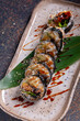 Sushi roll with eel, nori, cucumber and sesame seeds