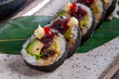 Sushi roll with tuna, avocado, red caviar and wasabi
