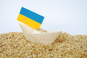 Wall Mural - Ukrainian flag grain wheat and spikelets on dark background. Ukraine Russia conflict, Grain deal and problem of blockade of ports, grain corridor