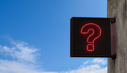 Wall Mural - question mark design from led light on outdoor wall black metal signpost with clear sky background