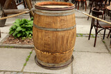 Fototapeta  - Traditional wooden barrel on street outdoors. Wine making