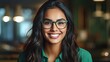 © pham - A woman wearing glasses smiling at the camera