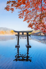 Canvas Print - Yufuin, Japan - Nov 27 2022: Tenso-jinja shrine at lake Kinrin, is one of the representative sightseeing spots in the Yufuin area at the foot of Mount Yufu.