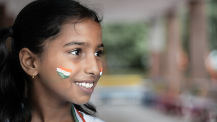 Portrait of Cute India Child or Kids celebrating Independence or Republic day of India