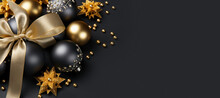 Christmas Black Background With Copy Space. Black And Golden Baubles And Stars Decorated With Gold Bow.