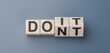 © Celt Studio - Doit or dont. flip wooden cube block with word dont change to do it. Personal development and career growth or change yourself. Text on wooden blocks and changing cubes