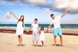 © BillionPhotos.com - Happy young family walking at beach