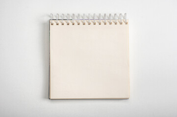 mockup notebook. Spiral notebook from top view with empty white space, square notepad with blank sheet