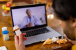 © Wavebreak Media - Indian man holding medication making video call using tablet at home