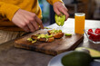 © Wavebreak Media - Hands of indian man preparing sandwiches with avocado in kitchen at home