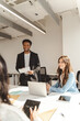 © Maria Vitkovska - Group of smiling business people working in modern office, talking, cooperation, sharing ideas, planning startup. University students studying together. Meeting Teamwork Successful business