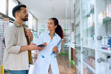 Poster - Happy Chinese pharmacist assists her customer in buying medicine in pharmacy.