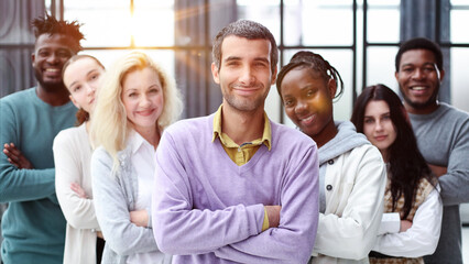 Wall Mural - Group of business people standing at the window of a modern office