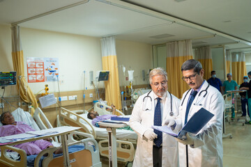 Wall Mural - Indian doctor looking medical report at hospital.