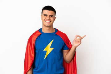 Poster - Super Hero over isolated white background pointing finger to the side