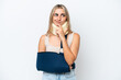 © luismolinero - Woman with broken arm and wearing a sling isolated on white background having doubts and thinking
