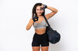 © luismolinero - Young sport Arab woman with sport bag isolated on white background focusing face. Framing symbol
