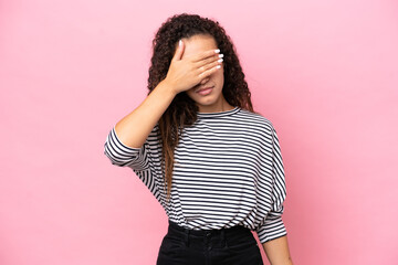 Wall Mural - Young hispanic woman isolated on pink background covering eyes by hands. Do not want to see something