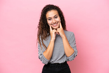 Wall Mural - Young hispanic woman isolated on pink background smiling with a happy and pleasant expression