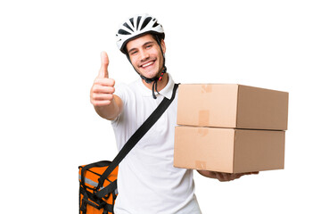 Wall Mural - Delivery man wearing a helmet bike over isolated background with thumbs up because something good has happened