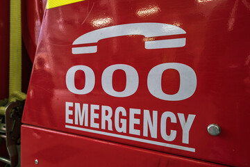 Triple zero emergency help line sign on a fire truck