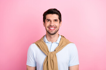 Wall Mural - Portrait of positive minded man beaming smile look up above empty space information isolated on pink color background