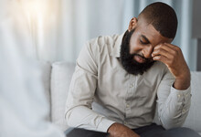 Sad Black Man, Therapist And Counselling For Psychology, Mental Health Crisis And Therapy For Stress. Confused Patient Consulting Psychologist For Frustrated Problem, Anxiety And Crying In Depression