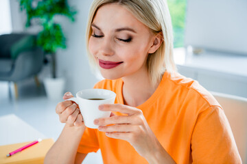 Canvas Print - Photo of positive cheerful lady sitting in dining room cafe cafeteria interior smell fresh coffee