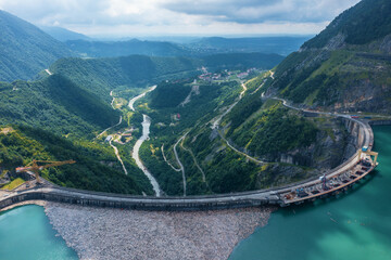 Inguri hydroelectric power plant in Georgia. Aerial view from drone of huge water dam. Hydropower energy station on Inguri River.