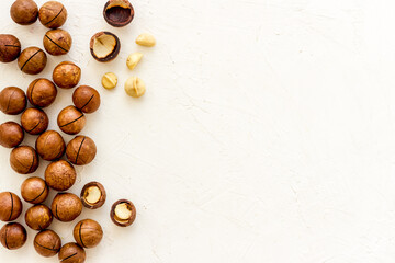 Wall Mural - Flat lay of macadamia nuts, top view. Healthy protein food background