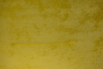 yellow velvet fabric texture used as the background. empty yellow fabric background of soft and smoo