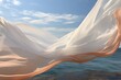 Silk fabric develops in the wind against the background of the sea and sky