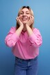 © Ivan Traimak - young pretty blond european office worker woman with flowing hair in a pink blouse smiles sweetly