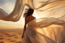 Woman In Silk Dress Evolved On Wind. Beach Sand On Background.