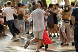Fototapeta Natura - Couple dancing bachata on the street