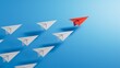 Leadership concept with red paper plane leading among white on blue background.3D rendering on blue background.
