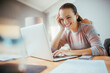 © Geber86 - Young woman working on her laptop at home and going over her bills